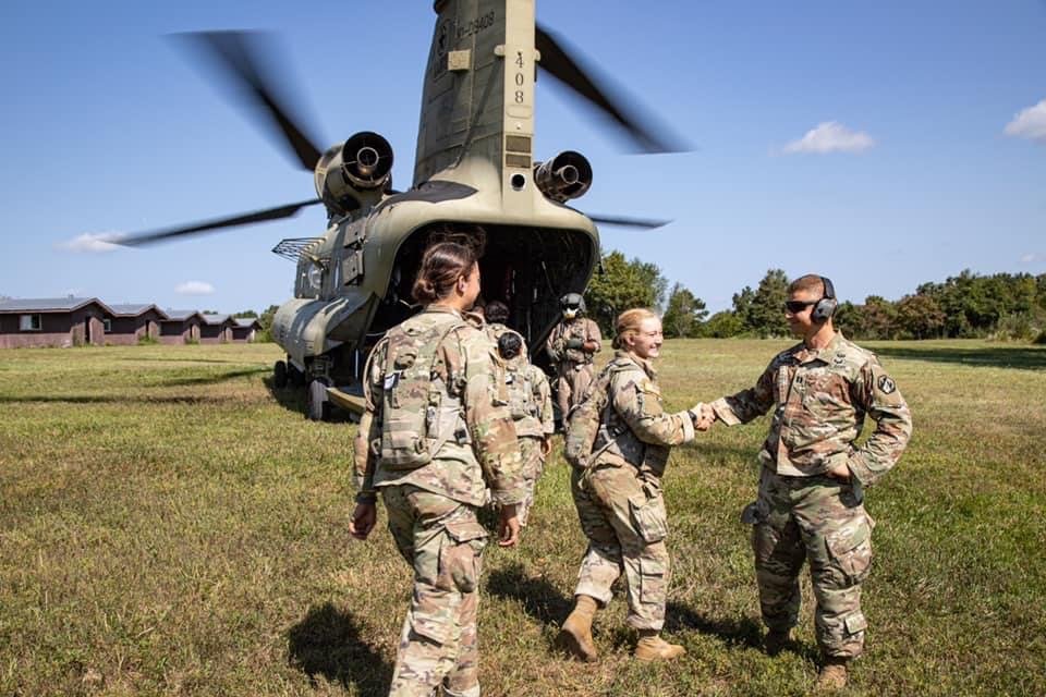 In his previous assignment as a U.S. Army chaplain at Fort Leonard Wood, Missouri, Father Luke Willenberg wishes a group of female soldiers in Basic Training Godspeed as they climb aboard a Chinook helicopter for a flight.